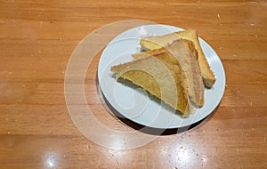 Pile of toasted bread slices on a single white plate. High energy and nutrient for breakfast