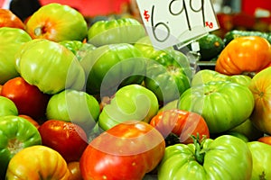 Pile of tomatoes on display at a local market