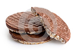 Pile of two and half chocolate rice cakes isolated on white.