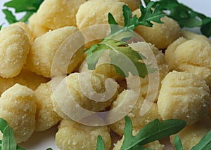 Pile of Uncooked Gnocchi with arugula