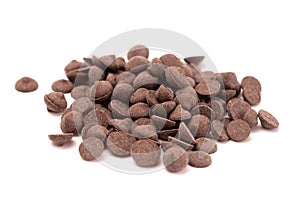 Pile of Unsweetened Carob Chips on a White Background photo