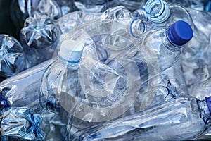 Pile of used plastic bottles as background, closeup. Recycling problem