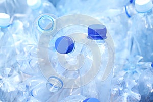 Pile of used plastic bottles as background, closeup. Recycling problem