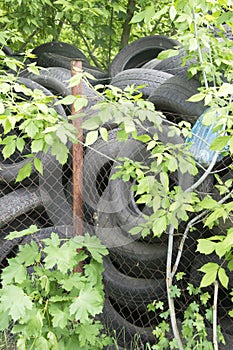 Pile of used tires. Old tyres waste for recycle or for landfill. Black rubber tire of car. Pile of used tires at recycling manufac