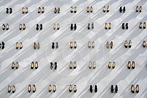 Pile of various female shoes over white.