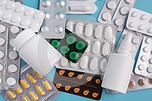 Pile of various shapes and sizes of drugs in different packaging