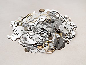 pile of various spare parts for mechanical watches