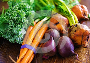 Pile of veggies with carrots, beets and kale