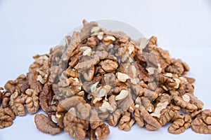 Pile of walnuts isolated on white background.