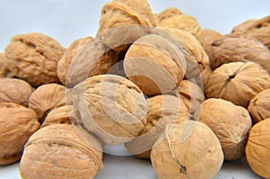 A pile of walnuts on the white background