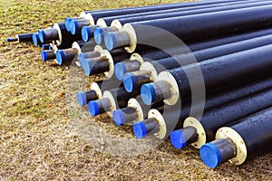 A pile of water pipes with thermal insulation