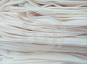 pile of white rayon cloth