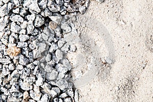 Pile of white sand and small gravel stone used as construction material photo