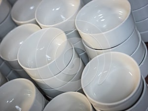 Pile of white small bowls