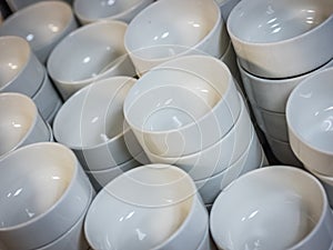 Pile of white small bowls