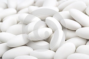 Pile of white sugared almonds