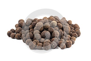 A Pile of Whole Allspice Berries on a White Background