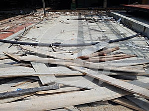 Pile of wood debris at a shop building demolition site, Construction waste on the restaurant floor