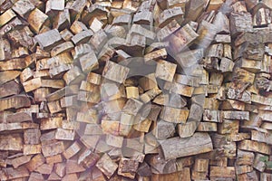 Pile of wood logs. Wood logs texture. Wooden background. Pile of wood close-up.