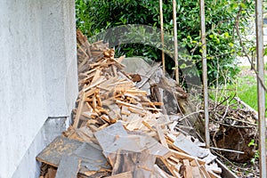 Pile of wood scraps cut up, or ready to be re-used and recycled, or otherwise considered junk rubbish. Wood from fence boards, or