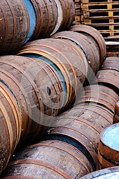 A pile of wooden barrels