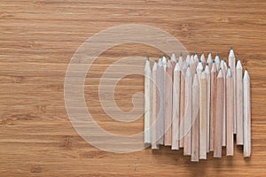 Pile of wooden pencils lying on the desk. Background for office themes.