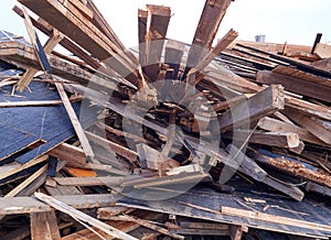 Pile of wooden planks at demolition site ready the recycling