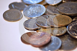 Pile of world coins with macro and white background