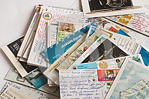 Pile of written postcards in disorder.