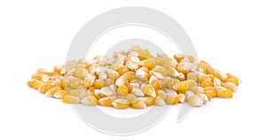 Pile of yellow corn kernels isolated over the white background