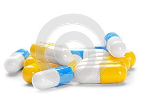 Pile of yellow pills and blue pills