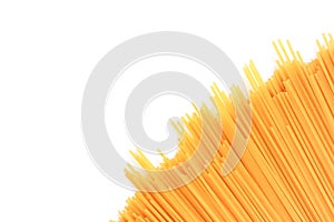 Pile of yellow raw spaghetti, yellow pasta, ready for cooking. isolated on white background, top view