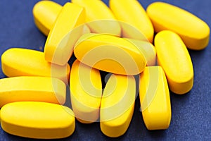 Pile of yellow tablets