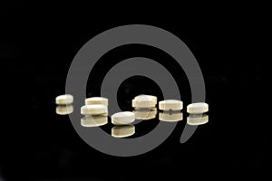 A pile of yellow tablets