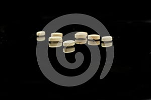 A pile of yellow tablets