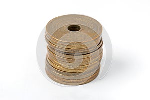 Pile of 5 yen coins japanese money on white background.