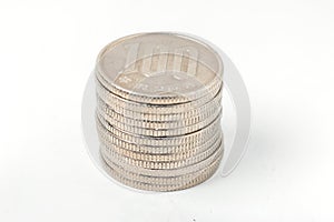 Pile of 100 yen coins japanese money on white background.