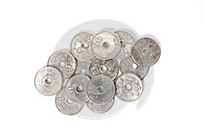 Pile of 50 yen coins japanese money on white background.