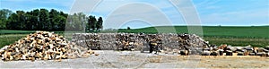 Wood pile, wood splitter and heap of wood photo