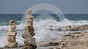 Piled up stones on the coast of the sea.