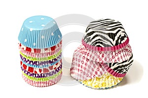 Piles of all colors cupcake paper cups.