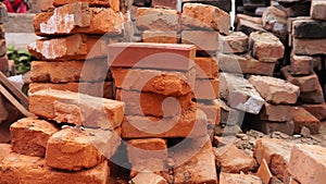 Piles of brick, Red brick for building houses. Many used wall bricks laid on a pile