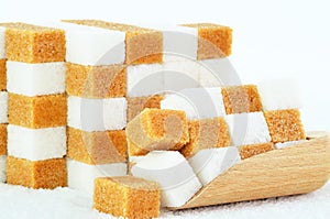 Piles of brown and white sugar cubes