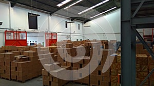 Piles of cardboard packages that fill the warehouse space1