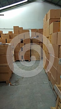 Piles of cardboard packages that fill the warehouse space2