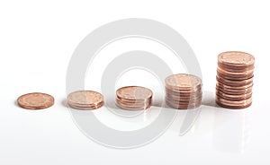 Piles of coins increasing in height