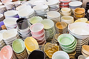 Piles of colorful ceramic bowls.