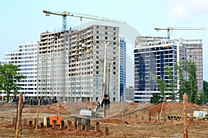 Piles driven into the ground by hydraulic hammer. Working at construction of a new metro line