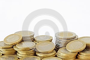 Piles of euro coins on white background