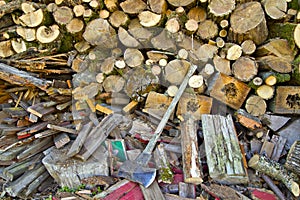 Piles of Firewood with Axe